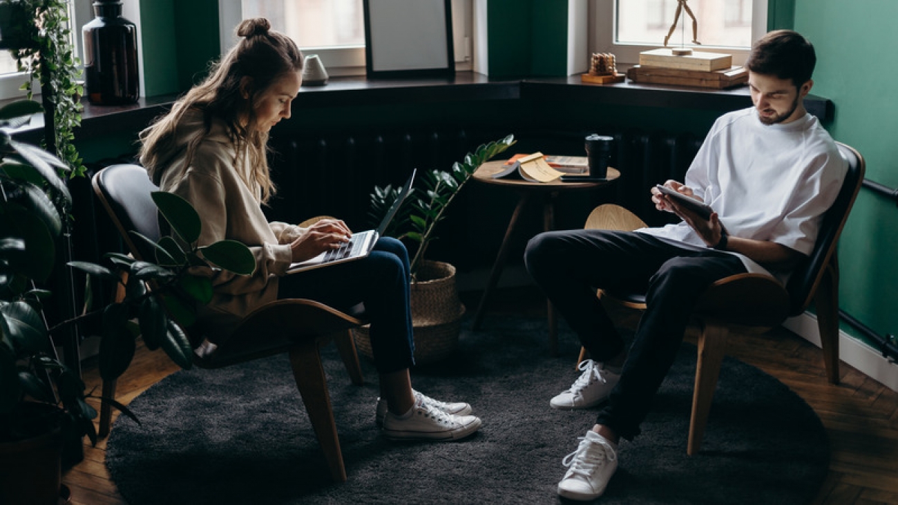 Canva - Photo of Two Person Using Their Gadgets (1)