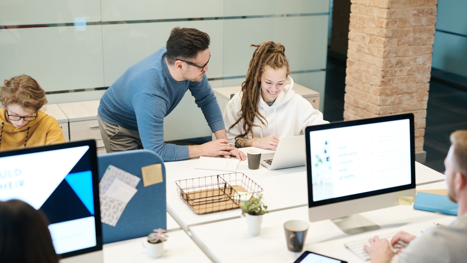 Canva - Group of People Sitting Indoors